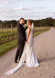 A bride and groom looking at each other at Dromana estate