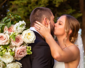 A couple kissing at a Vineyard Wedding at Dromana Estate Victoria